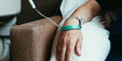 Man gettting treatment whil sitting in a chair