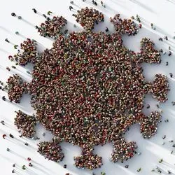 Photo of a group of people standing in the formation of the coronavirus