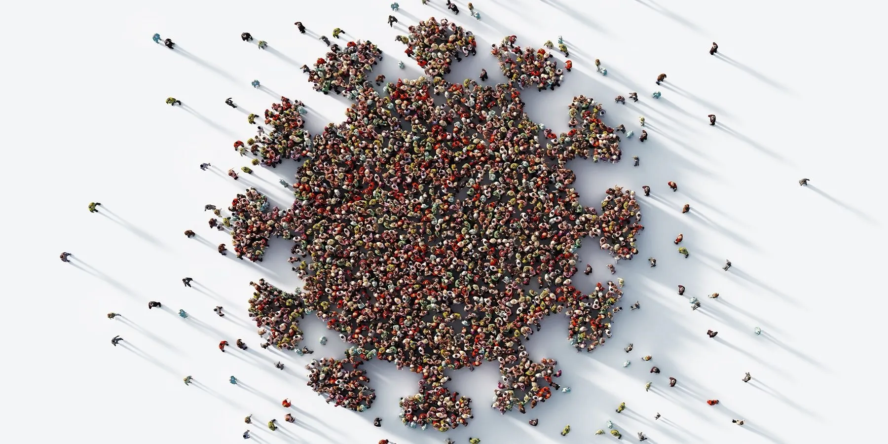 Photo of a group of people standing in the formation of the coronavirus