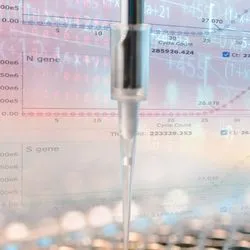 Pipette in front of screen displaying results