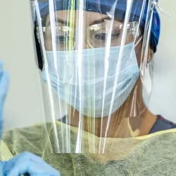Woman health care provider wearing PPE