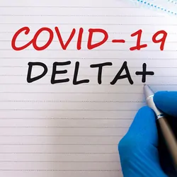 Gloved hand writing COVID-19 Delta+ on a notepad