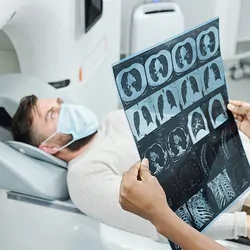 Female health care professional performing an MRI on a patient