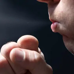 Man Coughing into his hand