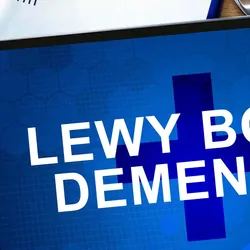 Image of a tablet with Lewy Body Demetia written on it next to a diagnosis sheet and some pills