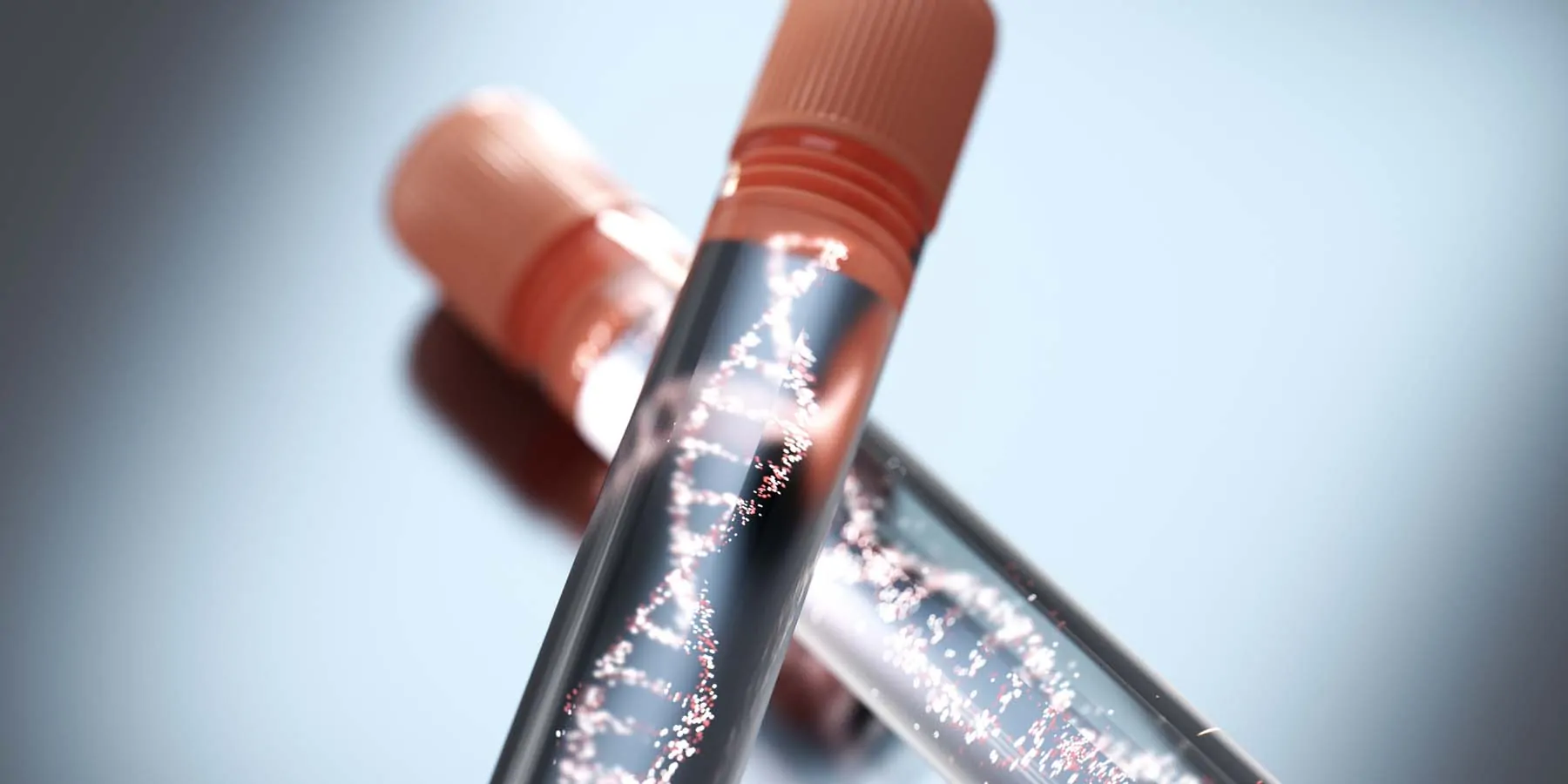 Two testubes with graphics of DNA in them