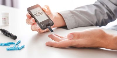 Man with diabetes testing his blood sugar levels