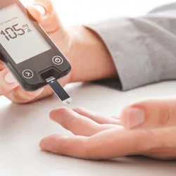 Man with diabetes testing his blood sugar levels