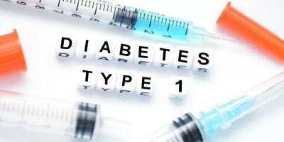 The words type 1 diabetes written with letter blocks next to 3 syringes