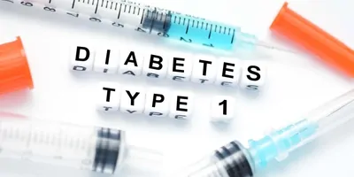 The words type 1 diabetes written with letter blocks next to 3 syringes