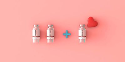 Image of two COVID-19 vaccine vials having a third added, on a pink backdrop