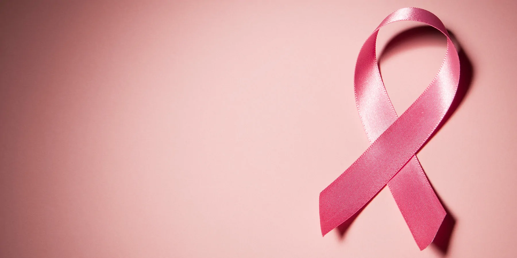 Diagnosing Breast Cancer Breast Cancer ribbon on a pink background