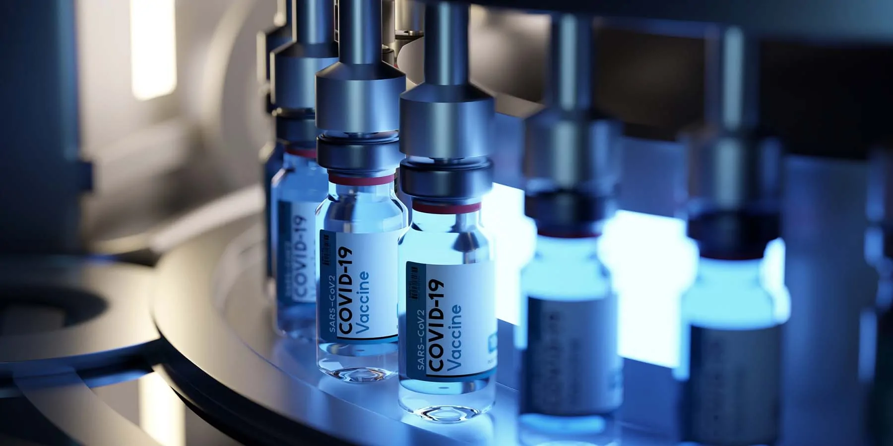 Vaccine bottles on a production line being filled