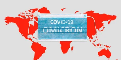 A face mask with the words COVID-19 Omicron written on it, that is on a backdrop of the world with the continents painted red