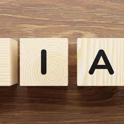 Wooden blocks on a table that have letters on them that spell the word "Bias"