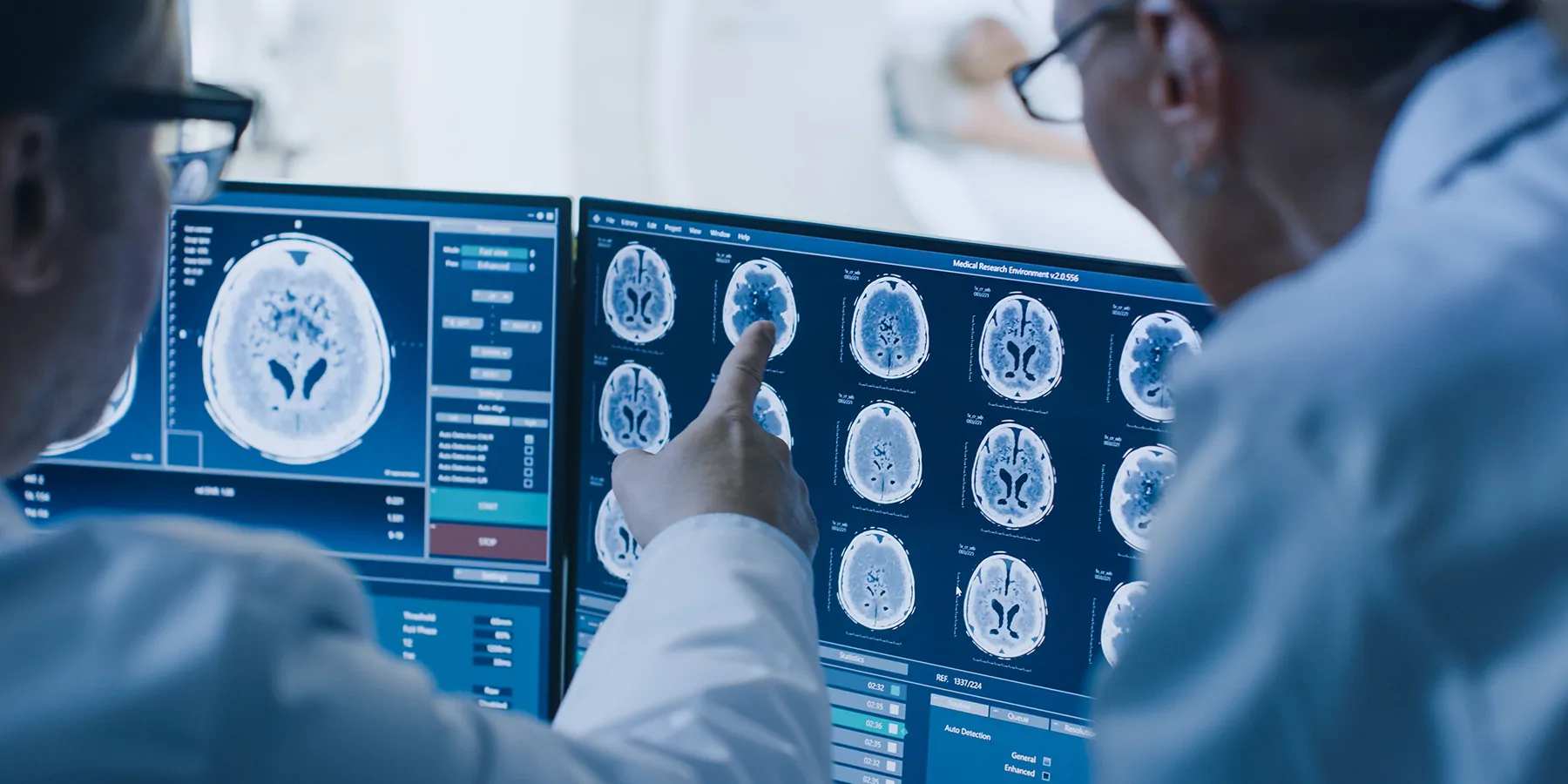 Researchers looking at an MRI image on a screen