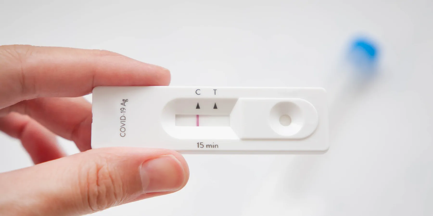 Low Incident of False Positive Test Results from Rapid Antigen Tests Person holding a rapid antigen test that is negative