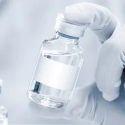 A clinical lab professionals wearing gloves holds a new class of universal vaccines 
