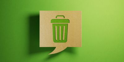 Image of a green garbage can against a green background.
