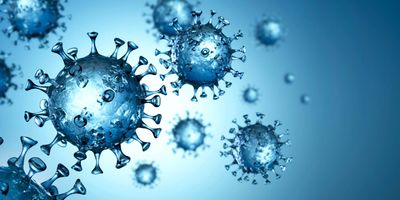COVID-19 viruses floating on a blue background