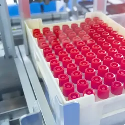 Robot arm in a clinical lab with test tubes for diagnostics assays.