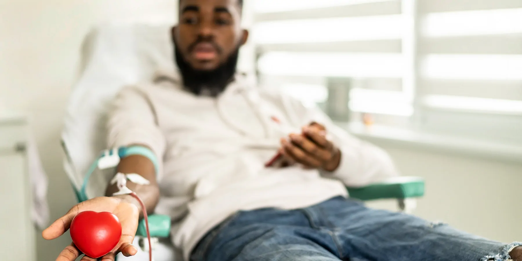 Photograph of a man donating blood to help address the US blood supply shortage.