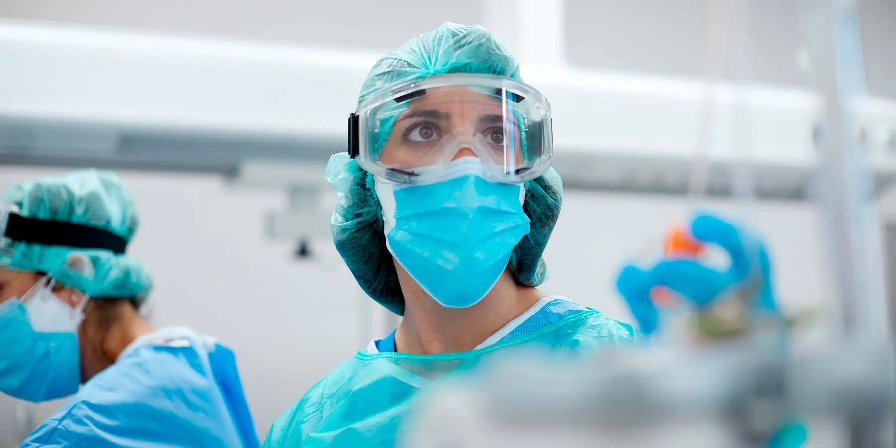 Health care provider in full PPE in a COVID-19 ward