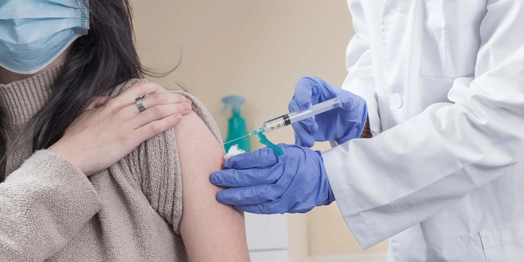 Third Vaccine Dose Critical for Protecting Populations against Omicron Variant Women getting vaccinated in the shoulder