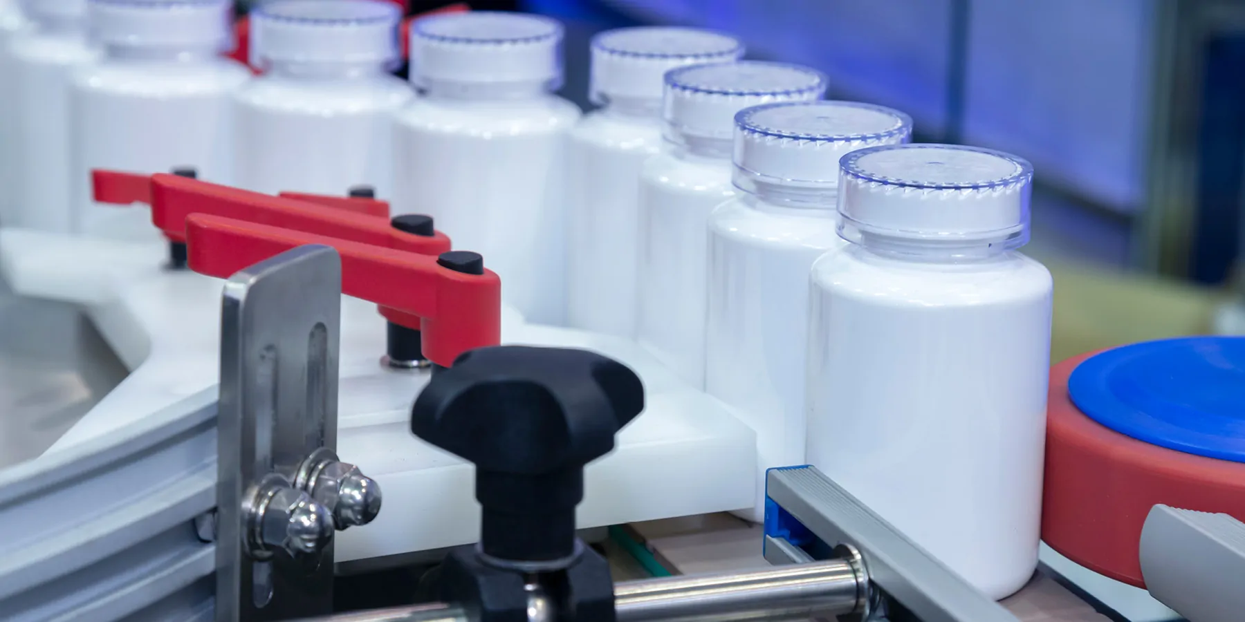 Photo of white plastic bottles of clinical laboratory reference materials for calibration verification.