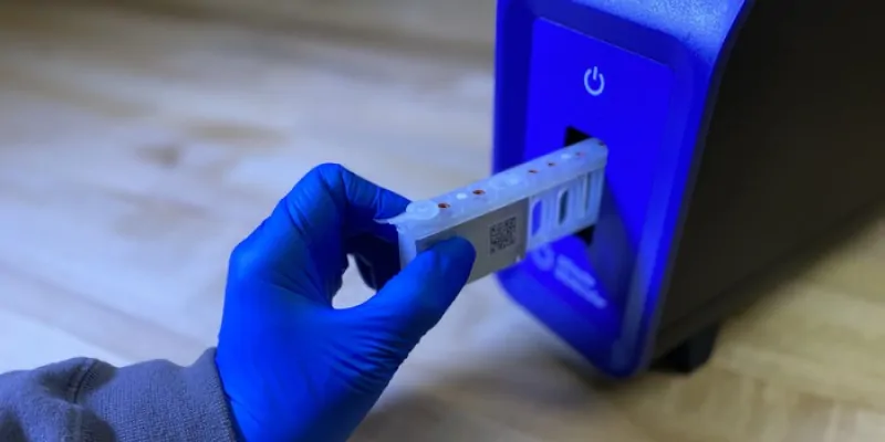 A person puts a sample into the DASH unit.