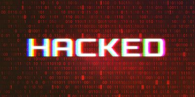 Photo of the words "hacked" on a red and black background illustrating the need for cybersecurity.