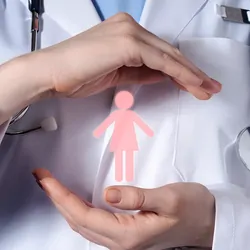 Female doctor holding a cut out of a paper woman