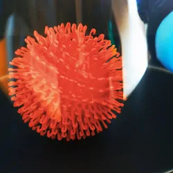 COVID-19 virus "trapped" in a glass held by gloved hands