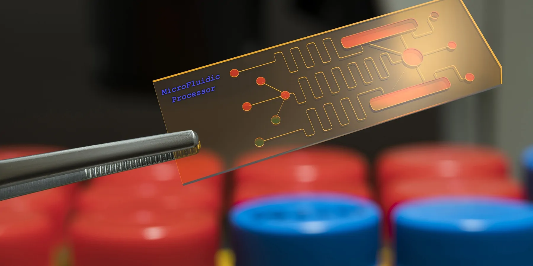 microfluidic processor, lab on chip, being held by tweezers