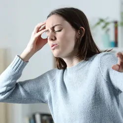 Women experiencing dizziness 