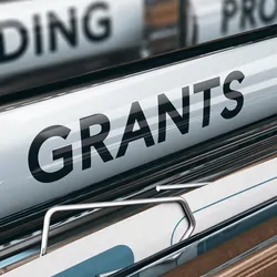 File folders with the words "Grants" and "Funding" written on them