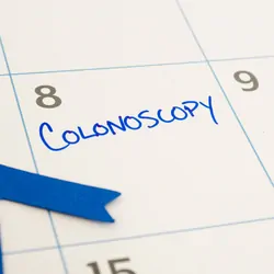 Colonoscopy appointment marked on the calendar during March, which is Colon Cancer Awareness month represented by the blue ribbon
