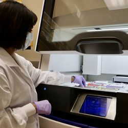 Photo of a technologist using the Genexus System at Courtesy of William Osler Health System.