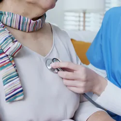 older asian women getting her heart checked