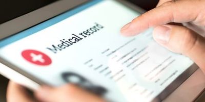 Person putting in patient information into a tablet