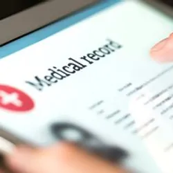 Person putting in patient information into a tablet