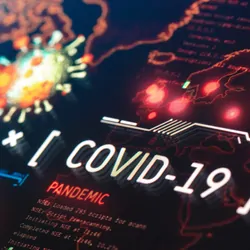 Illustration depicting the COVID-19 virus on a world map.
