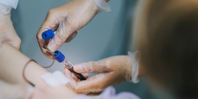 Health care provider drawin a blood sample for testing