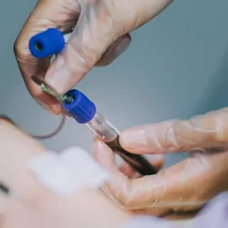 Health care provider drawin a blood sample for testing