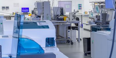 Photo of a clinical lab and their power cords and computers.