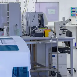 Photo of a clinical lab and their power cords and computers.