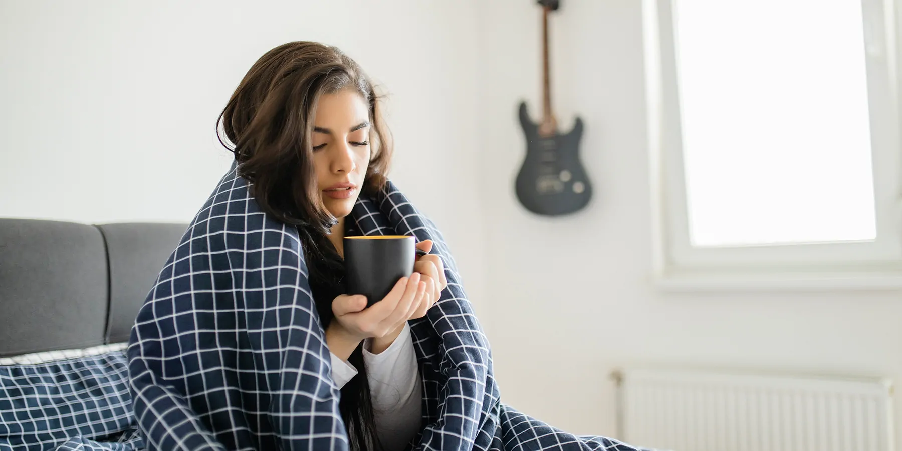 Five Minute Record for Diagnosis Woman, sick in bed with a mug of tea