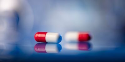 Red and white pills on a table