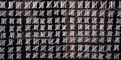 Photo of chalk marks on a chalk board making the days of long COVID.