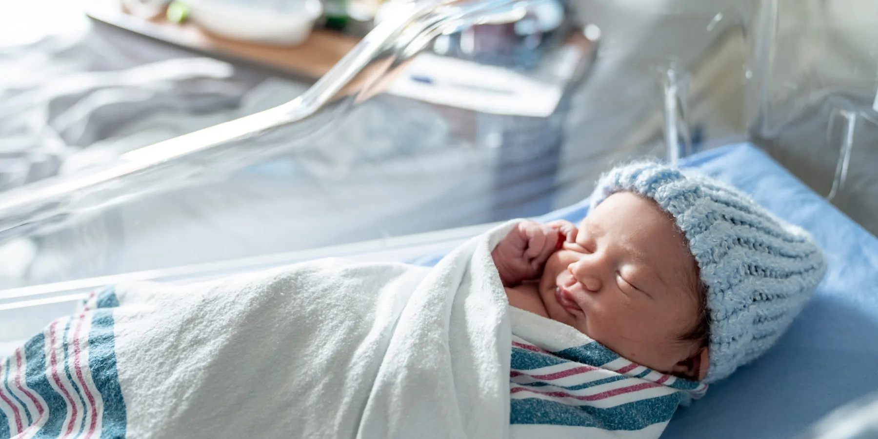 Newborn baby girl and mother in the hospital